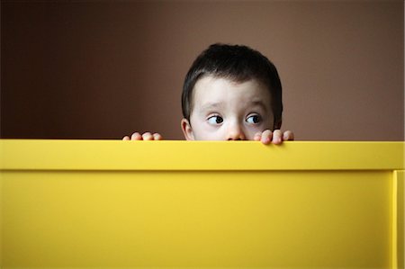 A little boy hiding Stock Photo - Rights-Managed, Code: 877-08129027