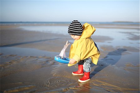 spring landscape kids - A 1 year old boy plays on the beach Stock Photo - Rights-Managed, Code: 877-08129099