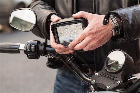 setting up a GPS on a motorbike Photographie de stock - Rights-Managed, Code: 877-08129244