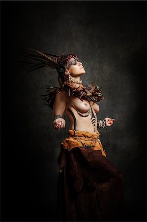 Tribal woman dancing in traditional costume Stock Photo - Rights-Managed, Code: 877-08129468