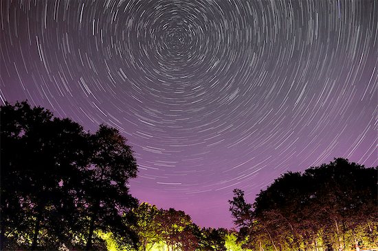 France, Burgundy. Yonne. Area of Saint Fargeau and Boutissaint. Lake of the Bumblebee. Starry sky. 40 minutes pose highlighting the rotation of the sky. Stock Photo - Premium Rights-Managed, Artist: Photononstop, Image code: 877-08898429