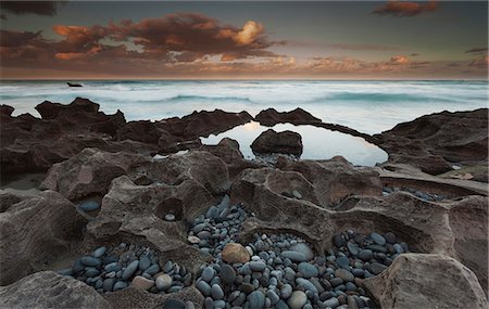 The coastline, bays and cliffs on Cape Agulhas near Arniston at sunset. Photographie de stock - Rights-Managed, Code: 878-07442670