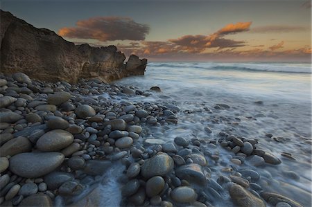 flowing water - The coastline, bays and cliffs on Cape Agulhas near Arniston at sunset. Stock Photo - Rights-Managed, Code: 878-07442671