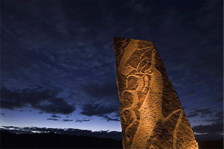 North-central Mongolian stone engravings, potentially more than three thousand years old. Grave markers or signs from ancient civilization. Photographie de stock - Rights-Managed, Code: 878-07442716