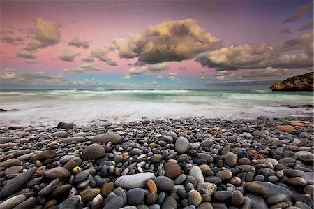 The view out to sea at the southern most point of Africa, Cape Agulhas in South Africa at sunset. Stock Photo - Rights-Managed, Code: 878-07442786