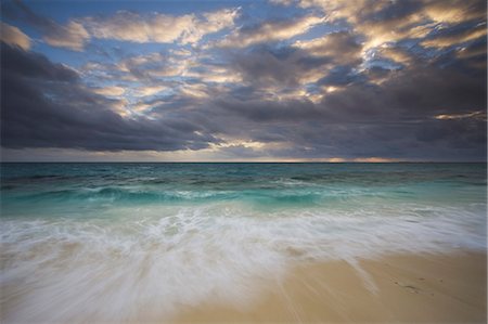 The beach and the water's edge. A cloudy sky. Stock Photo - Rights-Managed, Code: 878-07442791