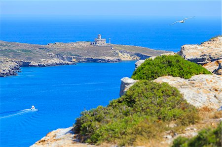 sea gull - Lighthouse of Capraia/Caprara/Capperaia Island from San Nicola Island with boat and seagull in flight. Tremiti Islands, Apulia, Italy. Stock Photo - Rights-Managed, Code: 879-09020940