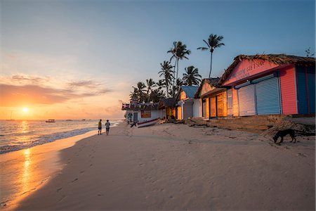 simsearch:879-09020639,k - Bavaro Beach, Bavaro, Higuey, Punta Cana, Dominican Republic. Beach huts at sunrise. Stockbilder - Lizenzpflichtiges, Bildnummer: 879-09021023