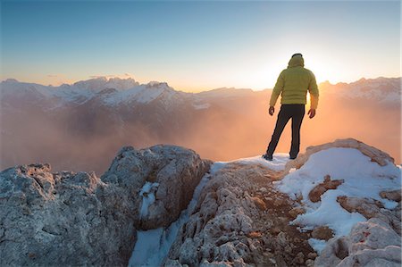 simsearch:879-09033587,k - Europe, Italy, Veneto, Belluno, Agordino, Palazza Alta, Dolomites. Hiker on a mountain top admiring the sun setting Stock Photo - Rights-Managed, Code: 879-09021046