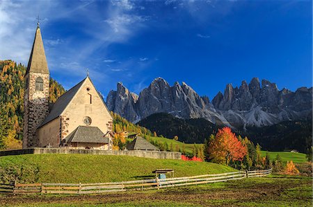 simsearch:879-09101075,k - Church of St. Magdalena immersed in the colors of autumn. In the background the Odle Mountains. Val di Funes. South Tyrol Stock Photo - Rights-Managed, Code: 879-09034092