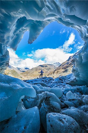 Hiker inside Forni Glacier Forni Valley Stelvio National Park Valfurva Valtellina Lombardy Italy Europe Stock Photo - Rights-Managed, Code: 879-09034132