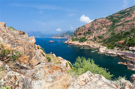 Blue sky and sun on the blue sea surrounded by granite cliffs and plants Porto Southern Corsica France Europe Photographie de stock - Rights-Managed, Code: 879-09034380