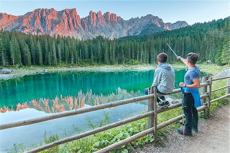 person by lake - Carezza lake at sunset, Trentino Alto Adige Region, Italy, Europe Stock Photo - Rights-Managed, Code: 879-09032784