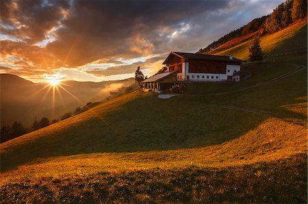 sunset farm - Last ray on a farm in the Funes valley, Coll, Santa Magdalena, South Tyrol region, Trentino Alto Adige, Bolzano province, Italy, Europe Stock Photo - Rights-Managed, Code: 879-09032966