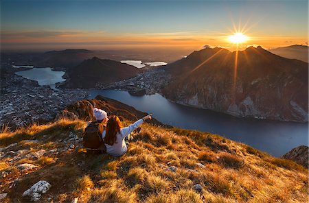 simsearch:879-09189599,k - Lake Como, Lombardy, Italy. Two friends watching a scenic sunset from above Lecco city. Photographie de stock - Rights-Managed, Code: 879-09032961