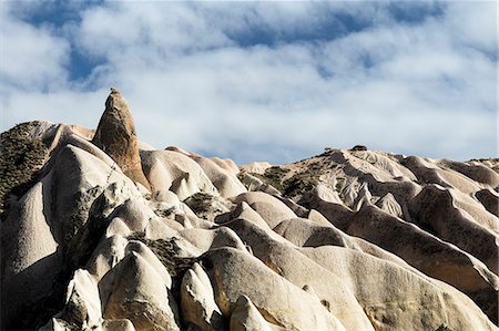 Half sky and half rocks of Tarihi Milli Parki, Cappadocia, Turkey (Turchia) Foto de stock - Con derechos protegidos, Código: 879-09033107