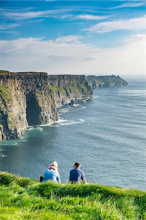 simsearch:879-09033247,k - Couple admiring the landscape. Cliffs of Moher, Liscannor, Co. Clare, Munster province, Ireland. Stock Photo - Rights-Managed, Code: 879-09033342