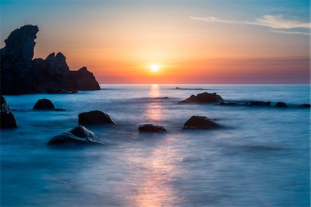 Zambrone, Calabria, Italy. Sunset on the beach of Capo Cozzo in Calabria with the Lion Rock Stock Photo - Rights-Managed, Code: 879-09033674