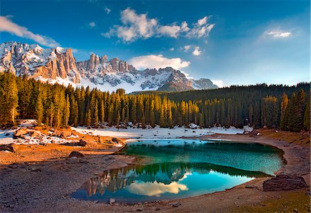 forests - Dolomites. The Carezza lake, with fir forests and the Latemar ridge in the background, at sunset Stock Photo - Rights-Managed, Code: 879-09033750