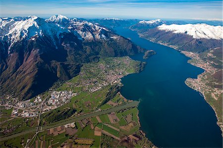 simsearch:879-09034194,k - Aerial view of Como Lake in all its length, Mount Legnone and Adda river High Lario, Lombardy, Italy Europe Foto de stock - Con derechos protegidos, Código: 879-09033989