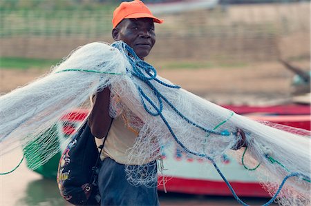 Africa,Malawi,Lilongwe district, Malawi lake. Fisherman with net fishing Foto de stock - Con derechos protegidos, Código: 879-09043285