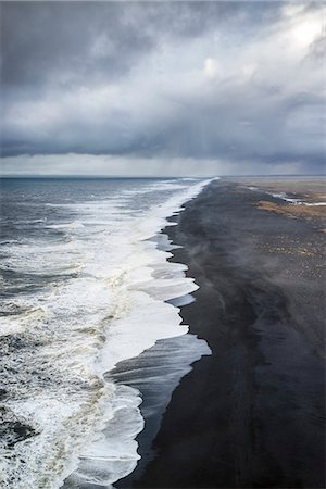 Aerial view of the long black sand beach of Reynisfjara, Vik, Sudurland, Iceland, Europe Stock Photo - Rights-Managed, Code: 879-09043460