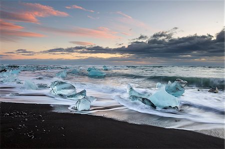 simsearch:879-09043654,k - a cold winter sunset in Jokulsarlon beach in mid-december, at low tide. the long exposure enhances the wave pattern. Stock Photo - Rights-Managed, Code: 879-09043684