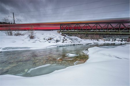 switzerland forest cantons - Bernina Express surrounded by snowy landscape Sankt Moritz Engadine Canton of Grisons Switzerland Europe Stock Photo - Rights-Managed, Code: 879-09043868