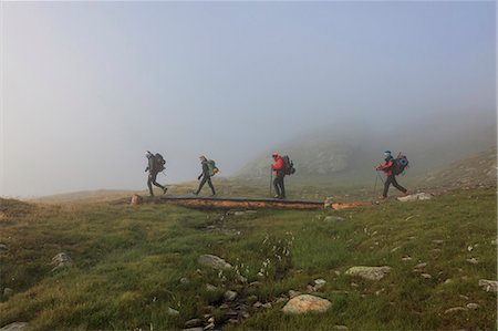 Hikers in the misty landscape at dawn Minor Valley High Valtellina Livigno Lombardy Italy Europe Photographie de stock - Rights-Managed, Code: 879-09043871