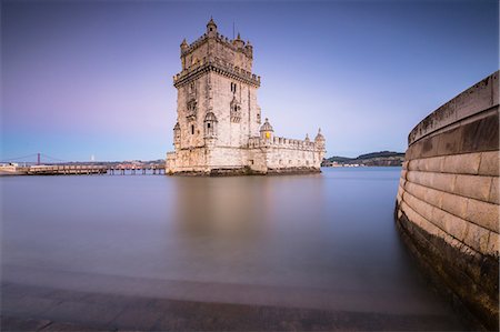 The colorful dusk on the Tower of Belém reflected in Tagus River Padrão dos Descobrimentos Lisbon Portugal Europe Stock Photo - Rights-Managed, Code: 879-09043901