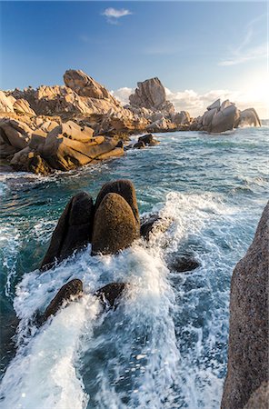 santa teresa gallura - Waves crashing on cliffs at sunset Capo Testa Santa Teresa di Gallura Province of Sassari Sardinia Italy Europe Photographie de stock - Rights-Managed, Code: 879-09043930