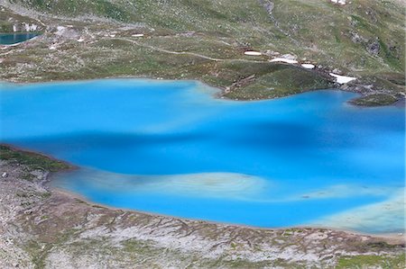 davos - Summer view of the turquoise alpine lake framed by rocks Joriseen Jörifless Pass canton of Graubünden Engadin Switzerland Europe Stock Photo - Rights-Managed, Code: 879-09043947