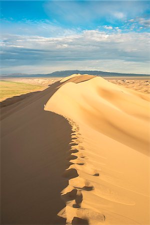 Footsteps on sand dunes in Gobi desert. Sevrei district, South Gobi province, Mongolia. Stock Photo - Rights-Managed, Code: 879-09100253