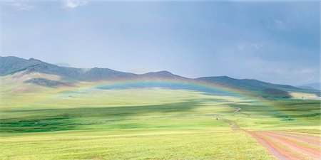 Rainbow over the green Mongolian steppe. Ovorkhangai province, Mongolia. Stock Photo - Rights-Managed, Code: 879-09100264