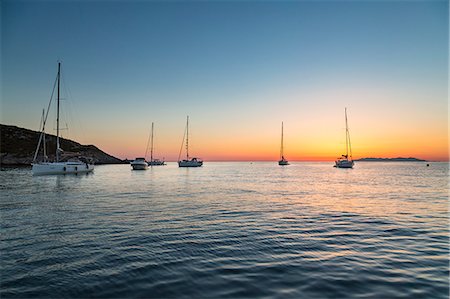 simsearch:6129-09044463,k - Sailing boats at sunrise, on background Capraia Island (Macinaggio, Rogliano, Bastia, Haute-Corse department, Corsica, France, Europe) Stock Photo - Rights-Managed, Code: 879-09100364