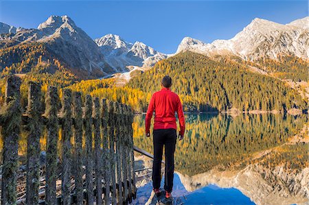 simsearch:879-09033412,k - Man admiring the mountains over the Antholzer see in the Antholz valley, South Tyrol, Bolzano, Italy Photographie de stock - Rights-Managed, Code: 879-09100516