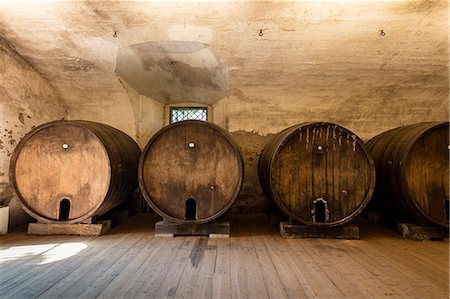 Wood barrels of wine cellar of the monastery of Astino, Longuelo, province of Bergamo, Lombardy, Italy, Europe Stock Photo - Rights-Managed, Code: 879-09100843