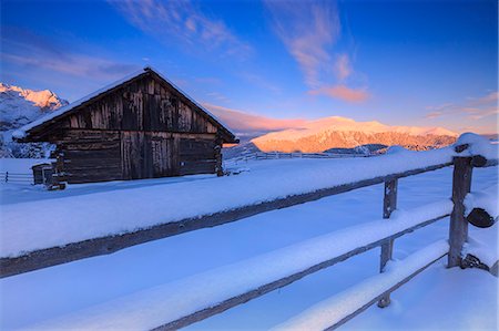 simsearch:879-09100702,k - Old snow-covered hut during sunrise. Erbe Pass, Funes Valley, South Tyrol, Dolomites, Italy Stock Photo - Rights-Managed, Code: 879-09128880