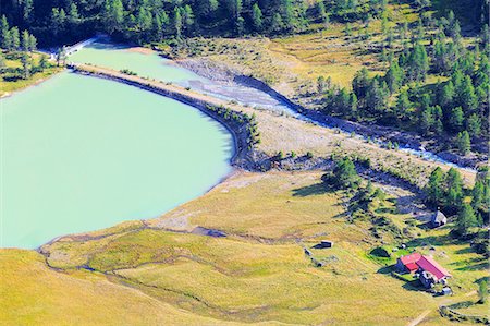 frison - Farm and dam of Alp Palü from above, Alp Palü, Val Poschiavo, Graubünden, Switzerland. Stock Photo - Rights-Managed, Code: 879-09128902