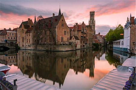 The medieval Belfry and historic buildings reflected in Rozenhoedkaai canal at dusk, Bruges,flemish region, West Flanders, Belgium, Europe Stock Photo - Rights-Managed, Code: 879-09128997