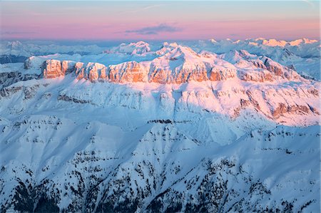 Enrosadira on the Sella group with Sass Pordoi and Piz Boè, aerial view, Dolomites, Alps, Belluno, Veneto, Italy Photographie de stock - Rights-Managed, Code: 879-09129126