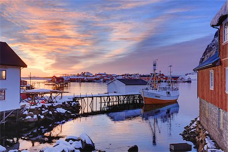 Fishing boat at a small fishing dock at Reine at sunrise in winter, lofoten islands, nordland, norway, europe Stock Photo - Rights-Managed, Code: 879-09129283