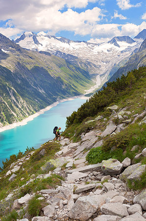 simsearch:879-09033095,k - Hiking in Zillertal Alp, with Lake Schlegeispeicher and Hochfeiler group on the background, Tyrol, Schwaz district, Austria. Fotografie stock - Rights-Managed, Codice: 879-09189503