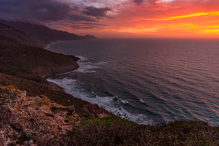 The sunset is reflected on the Beach of Masua, Iglesias