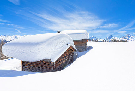 davos - Typical alpine huts after a heavy snowfall. Wiesner Alp, Davos Wiesen, Landwasser Valley, Albula Valley, District of Prattigau/Davos, Canton of Graubünden, Switzerland, Europe. Stock Photo - Rights-Managed, Code: 879-09189653