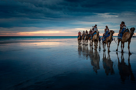 riding on the beach in the sun set - Camel tour ride at Cable Beach, Broome, Kimberley, Western Australia Stock Photo - Rights-Managed, Code: 879-09189732