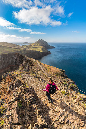 simsearch:400-04813407,k - Woman walking on the trail to Point of Saint Lawrence. Canical, Machico district, Madeira region, Portugal. Photographie de stock - Rights-Managed, Code: 879-09190023