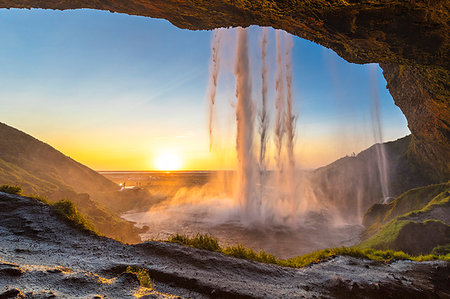 simsearch:879-09190371,k - Behind the Seljalandsfoss waterfall at sunset (Skogar, Southern Region, Iceland, Europe) Foto de stock - Con derechos protegidos, Código: 879-09190369