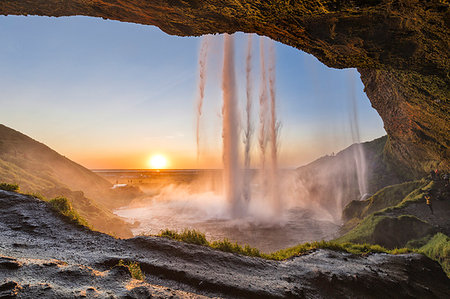 simsearch:879-09043439,k - Behind the Seljalandsfoss waterfall at sunset (Skogar, Southern Region, Iceland, Europe) Stock Photo - Rights-Managed, Code: 879-09190370