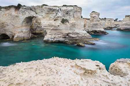 simsearch:879-09191093,k - The Faraglioni of Torre Sant'Andrea. Melendugno, province of Lecce, Salento, Apulia, Italy. Stock Photo - Rights-Managed, Code: 879-09190524